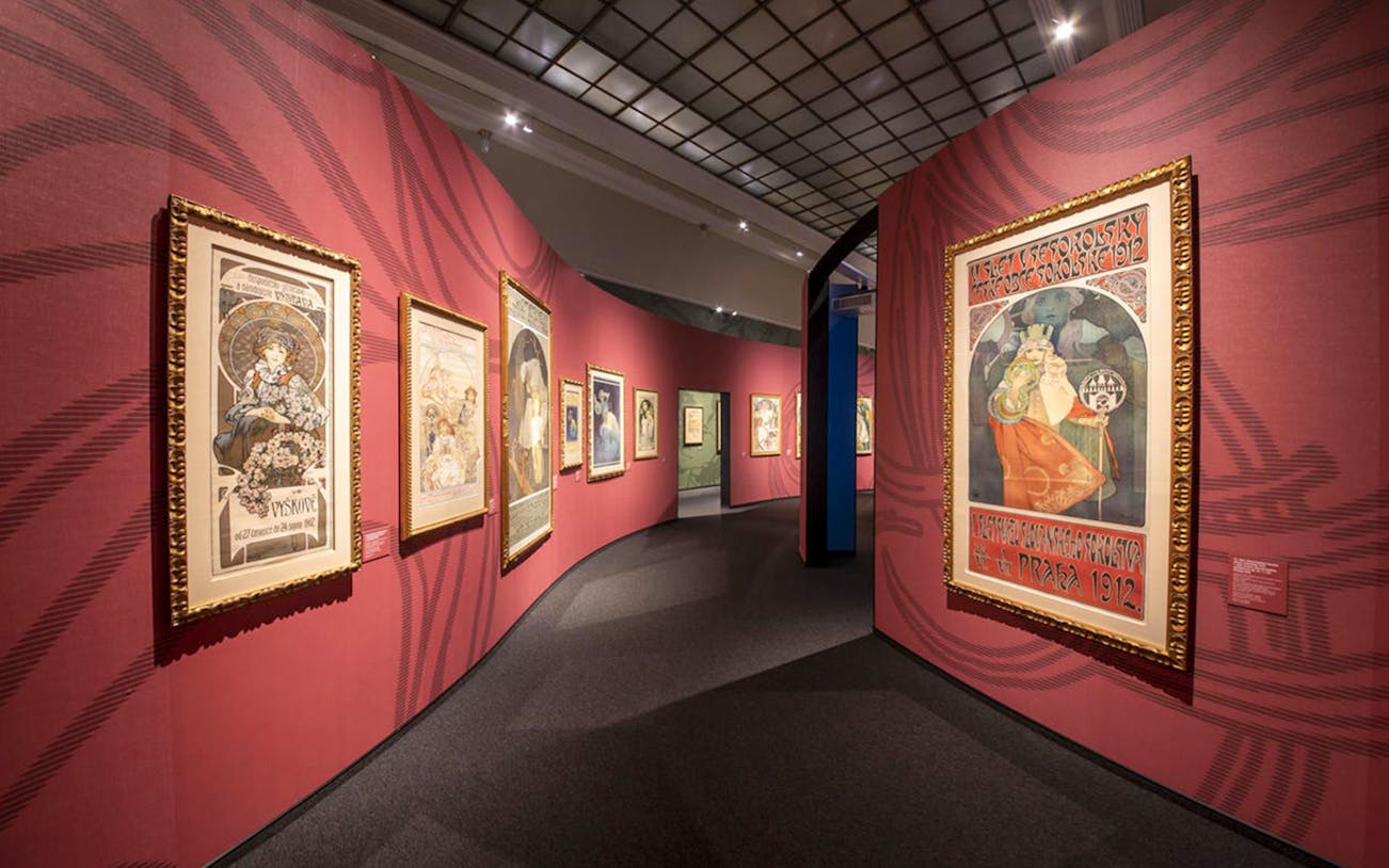 Art Nouveau posters displayed at iMucha Exhibition, featuring Alphonse Mucha's iconic works.