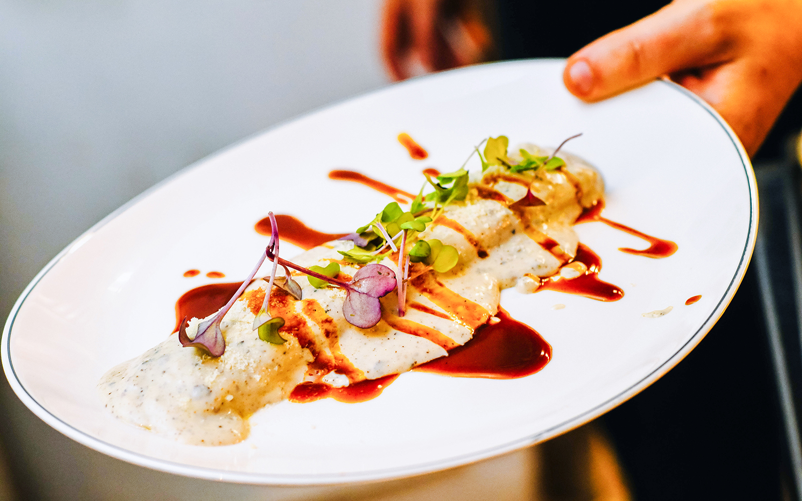 Gourmet foie cannelloni served elegantly in a luxury Parisian restaurant.