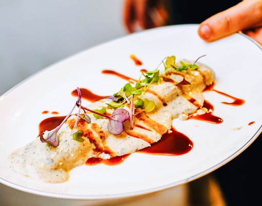 Gourmet foie cannelloni served elegantly in a luxury Parisian restaurant.