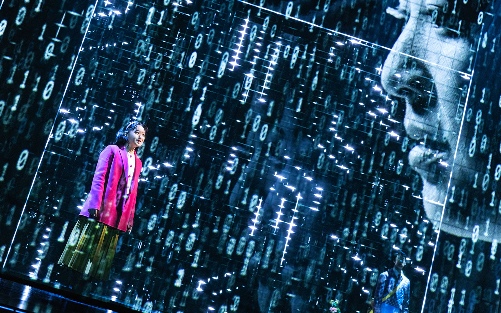 Performer on stage during Maybe Happy Ending Broadway show with digital backdrop.