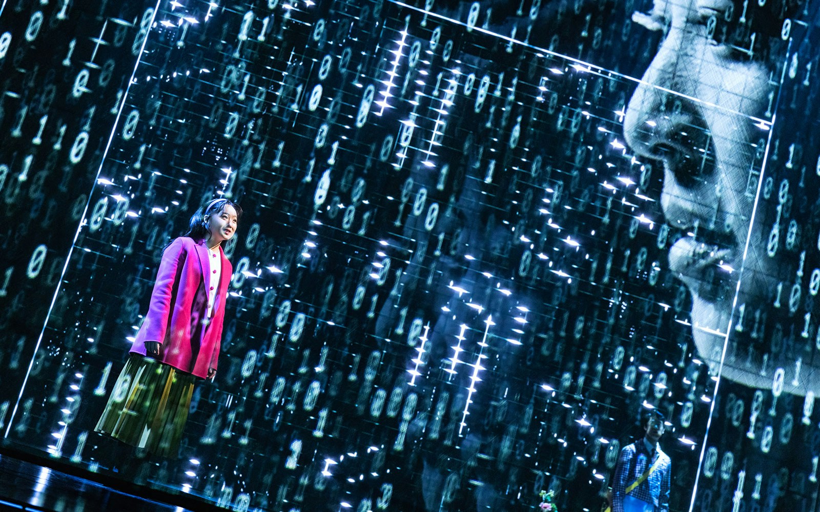 Performer on stage during Maybe Happy Ending Broadway show with digital backdrop.