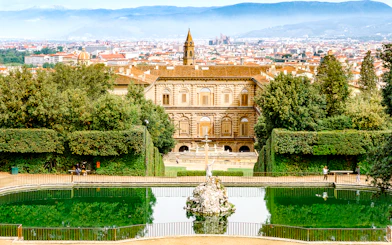 Pitti Palace and Boboli Gardens with Florence cityscape in the background.
