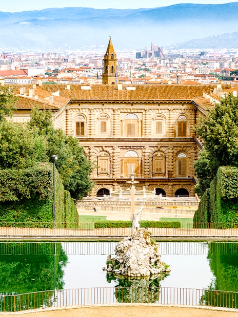 Pitti Palace and Boboli Gardens with Florence cityscape in the background.