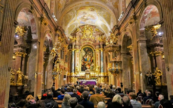 Audience attending Magic Trumpet Christmas Concert at St. Anne's Church, Vienna.