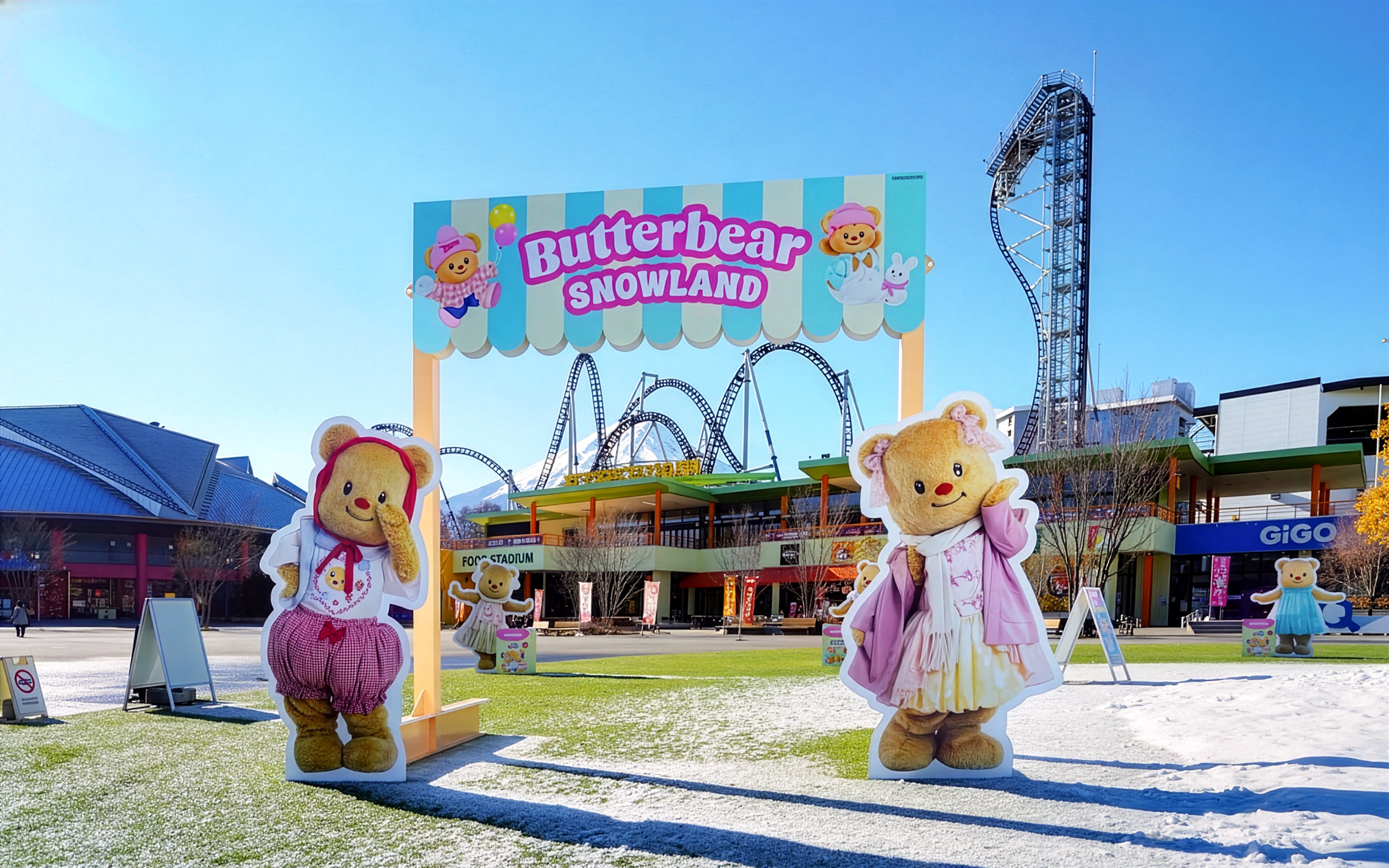 Butterbear Snowland entrance at Fuji-Q Highland Amusement Park with roller coaster in background.