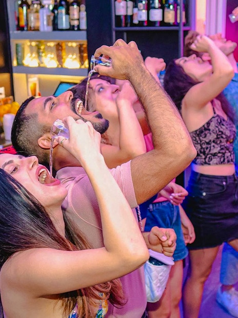 Group enjoying shots at a bar during the Tipsy Tour in Rome.