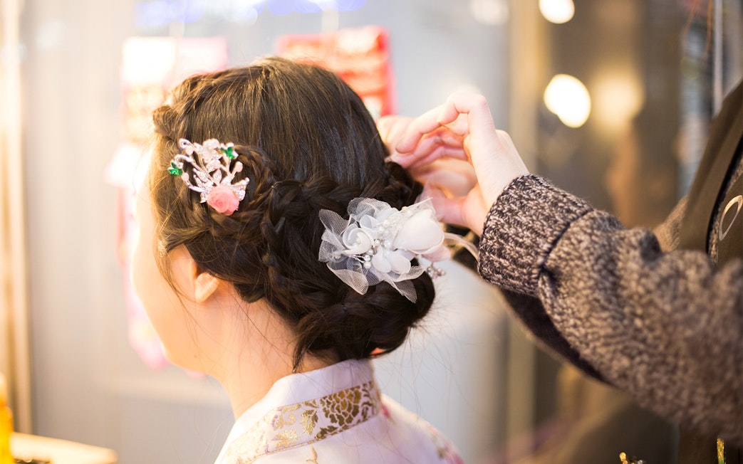 Hanbok hair styling at Seoul Gyeongbokgung Palace rental experience.