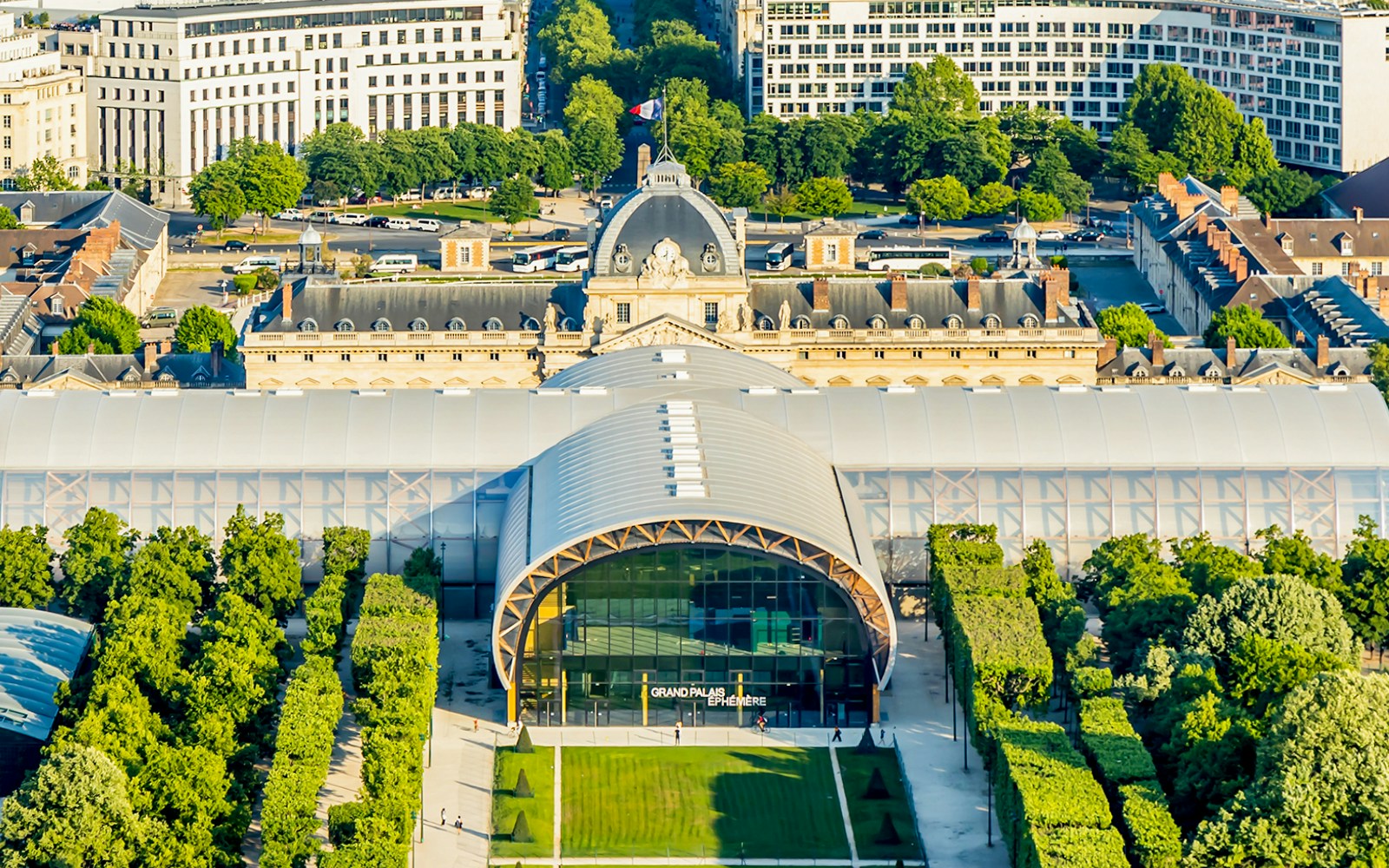 Aerial view of the Grand Palais Éphémère in Paris, showcasing its modern architecture and surrounding greenery.