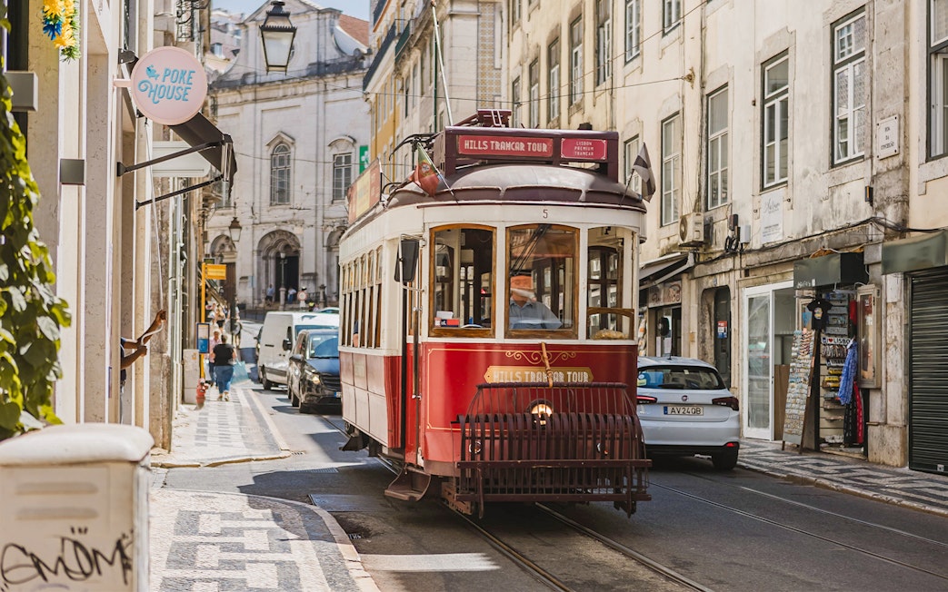 Lisbon tram on a city street during the Yellow Bus 24-hour hop-on hop-off tour.