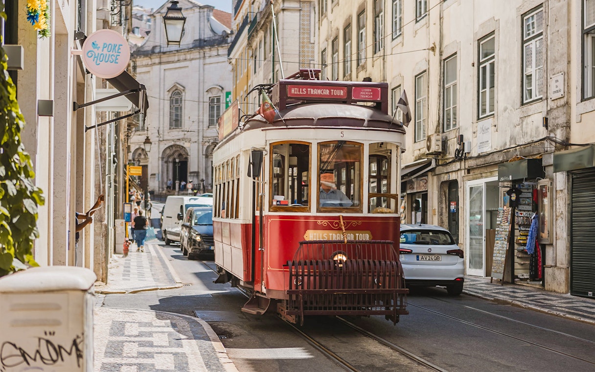 Lisbon tram on a city street during the Yellow Bus 24-hour hop-on hop-off tour.