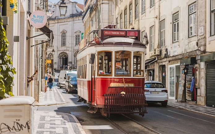 Lisbon tram on a city street during the Yellow Bus 24-hour hop-on hop-off tour.