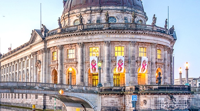 Bode Museum on Museum Island, Berlin, reflected in the Spree River at dusk.