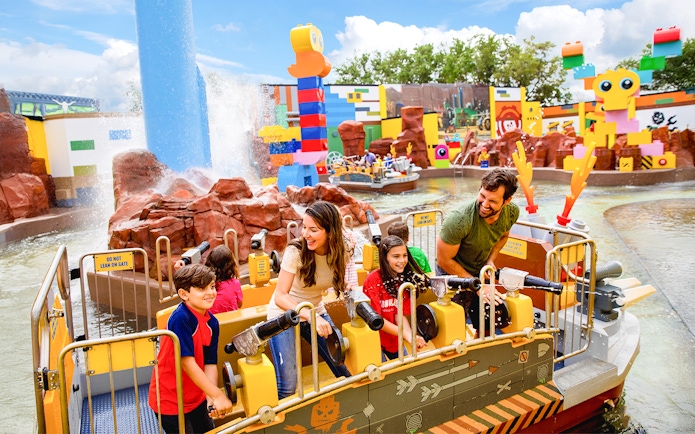 Families enjoying the Battle of Bricksburg water ride at LEGOLAND Theme Park, Florida.