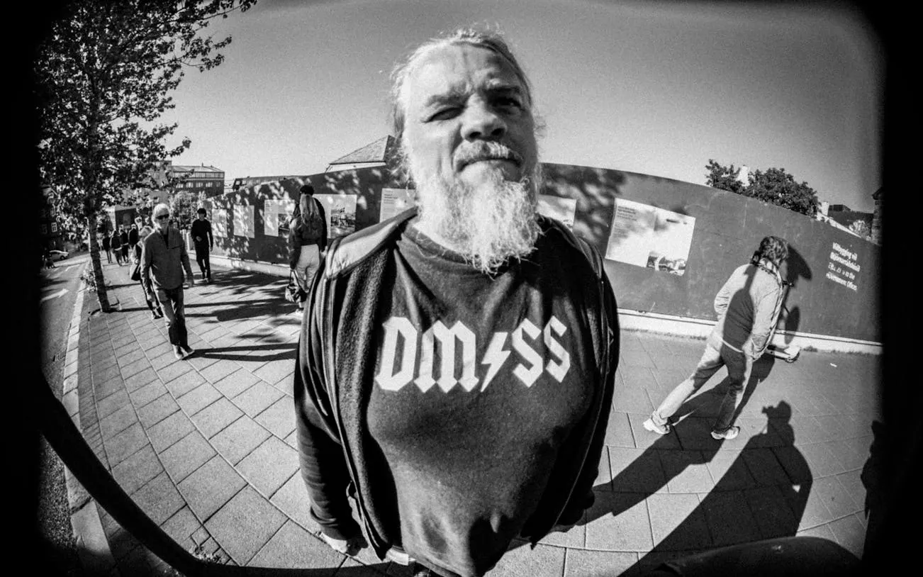 Reykjavik street scene with a man in a punk shirt, part of the Punk Museum walking tour.