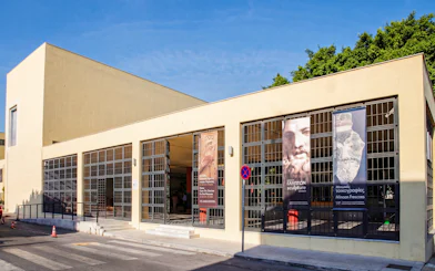 Heraklion Archaeological Museum entrance with banners displaying sculptures and frescoes.