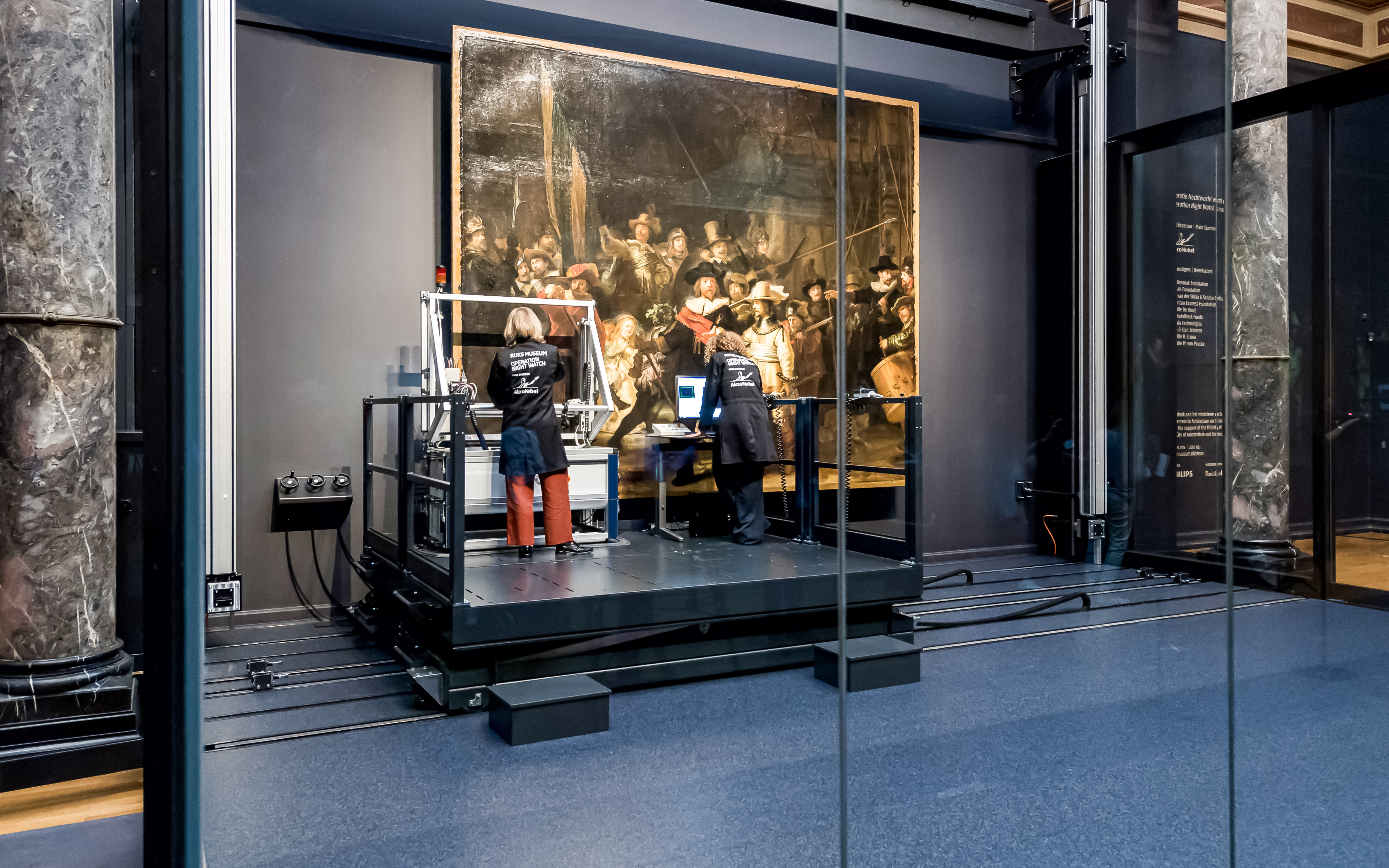 Conservators analyzing Rembrandt's Night Watch at Rijksmuseum, Amsterdam.