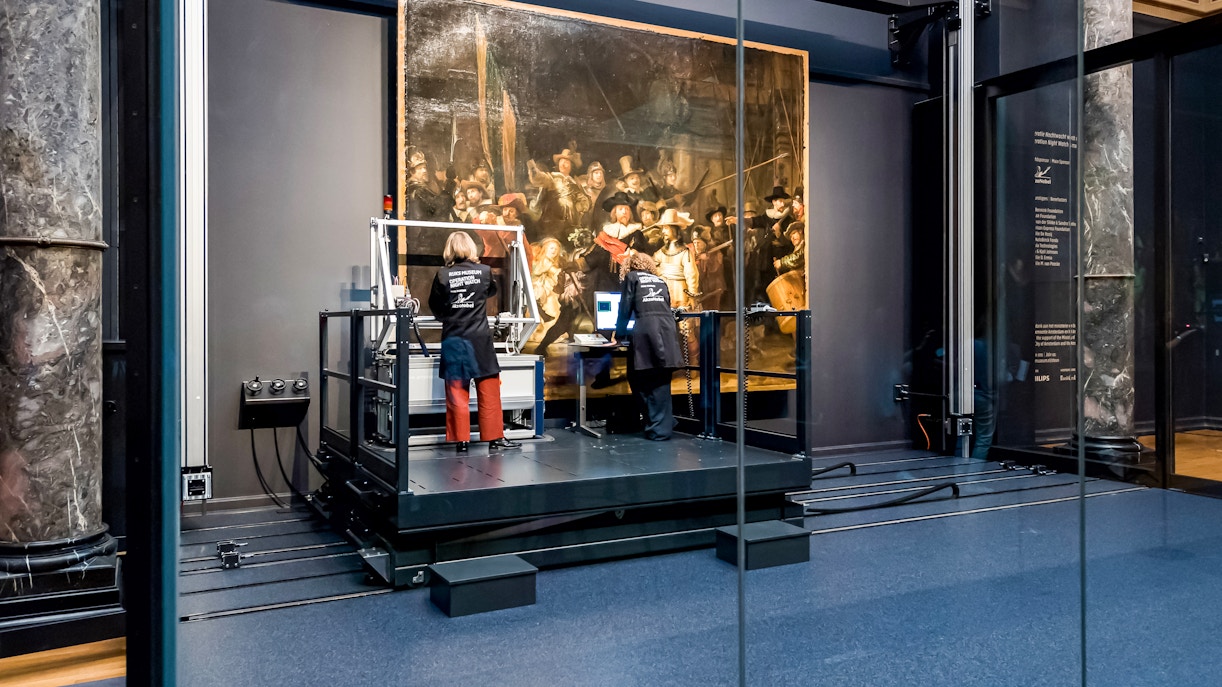 Conservators analyzing Rembrandt's Night Watch at Rijksmuseum, Amsterdam.