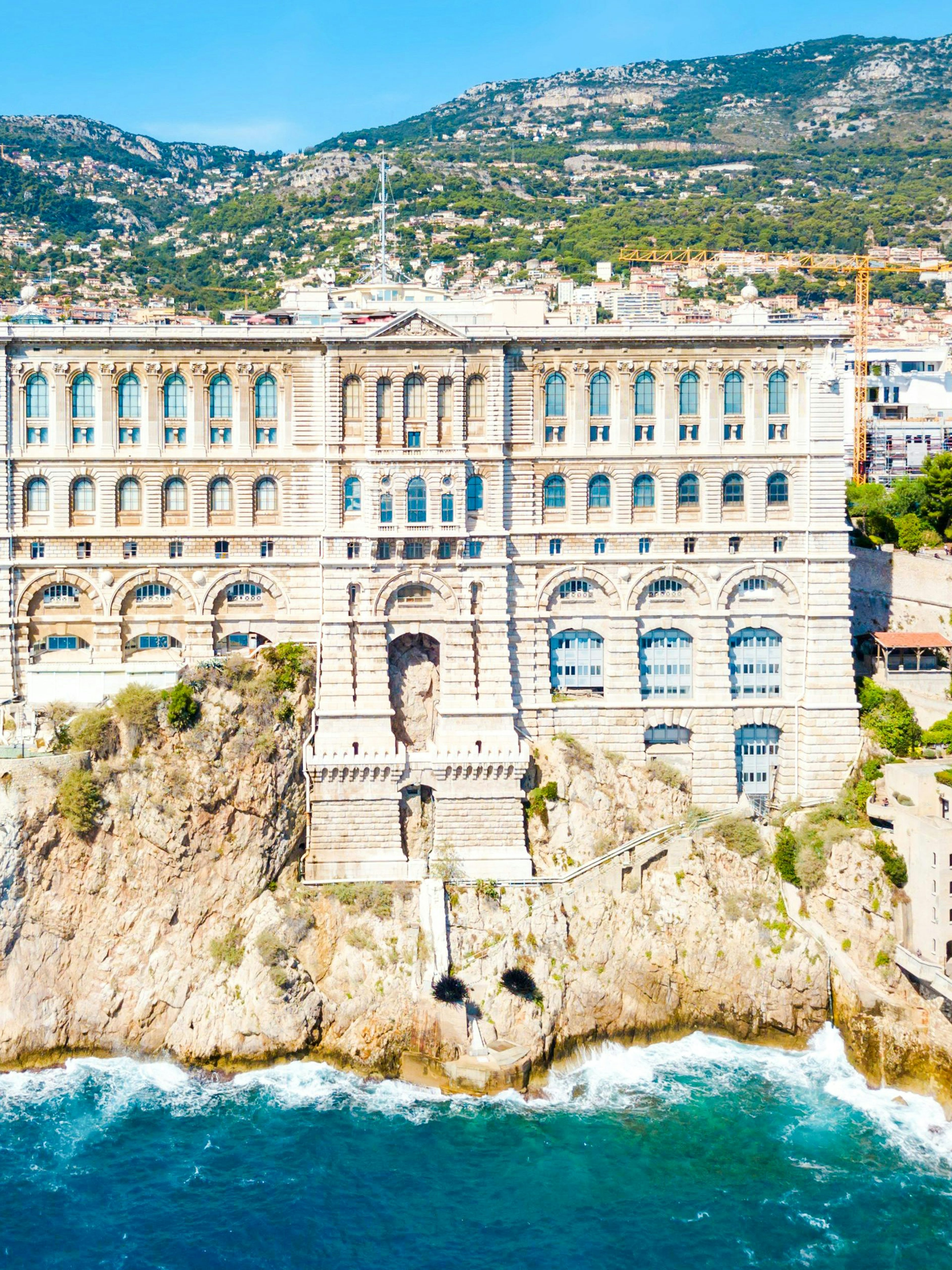 Oceanographic Museum in Monaco perched on a cliff overlooking the Mediterranean Sea.