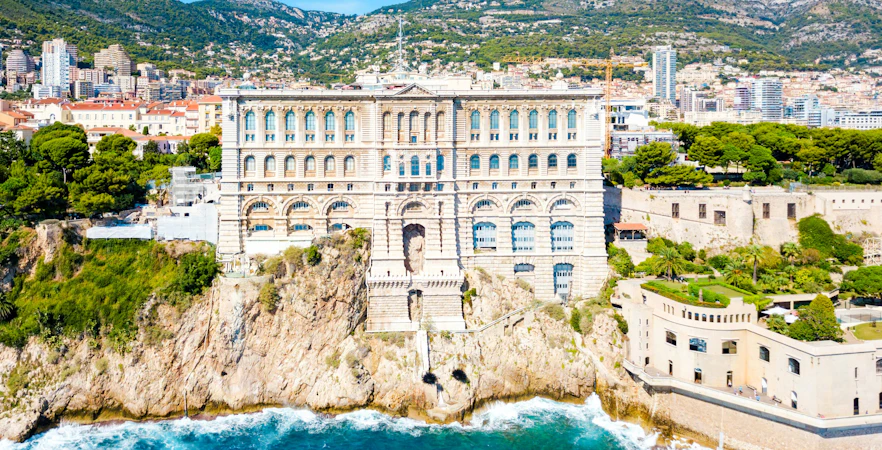 Oceanographic Museum in Monaco perched on a cliff overlooking the Mediterranean Sea.