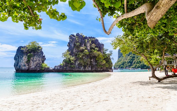 Tropical beach with limestone cliffs at Koh Hong island, Krabi.