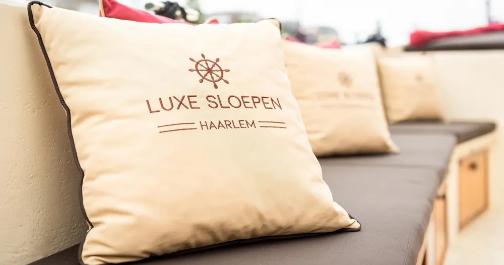 Luxurious seating on open boat for Harlem canal cruise.