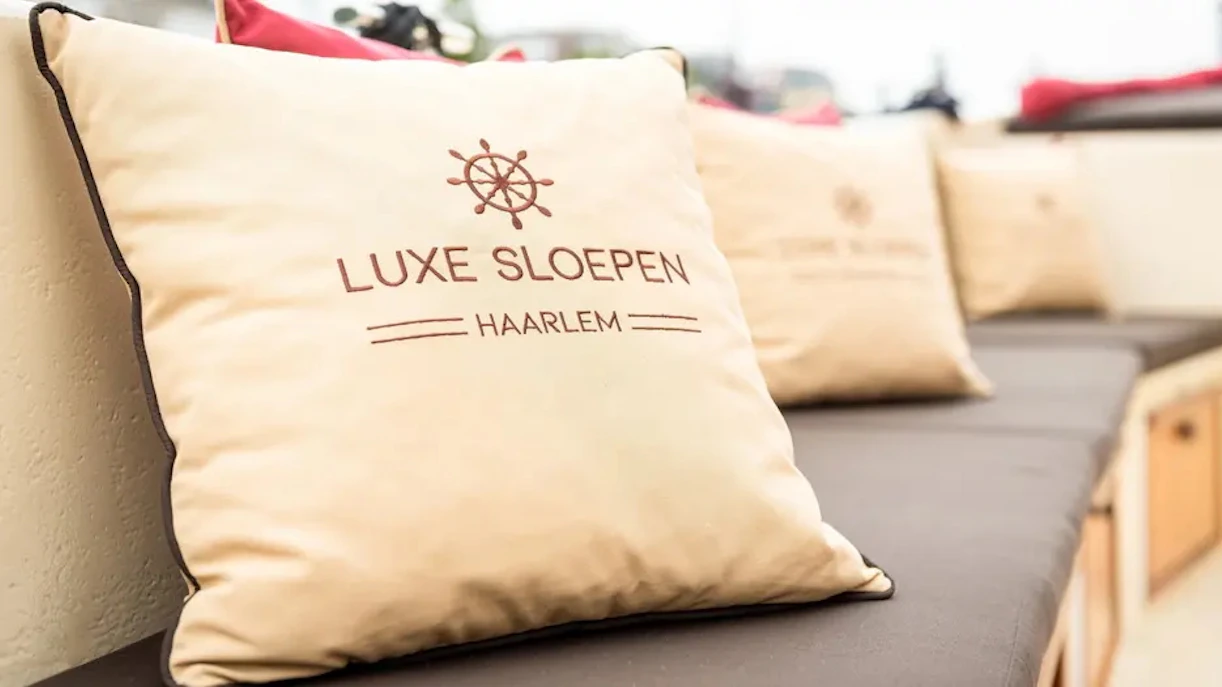Luxurious seating on open boat for Harlem canal cruise.