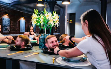 Interactive exhibit at DeJa Vu Museum in Berlin with optical illusion of head on a platter.