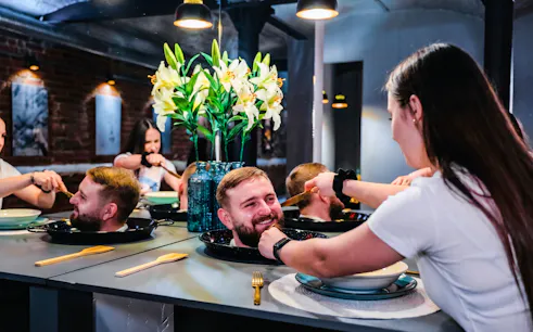 Interactive exhibit at DeJa Vu Museum in Berlin with optical illusion of head on a platter.