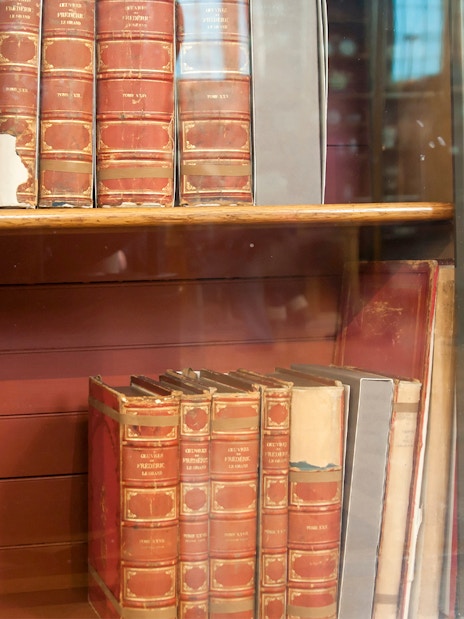 Books displayed in a glass cabinet at the National Gallery, London.