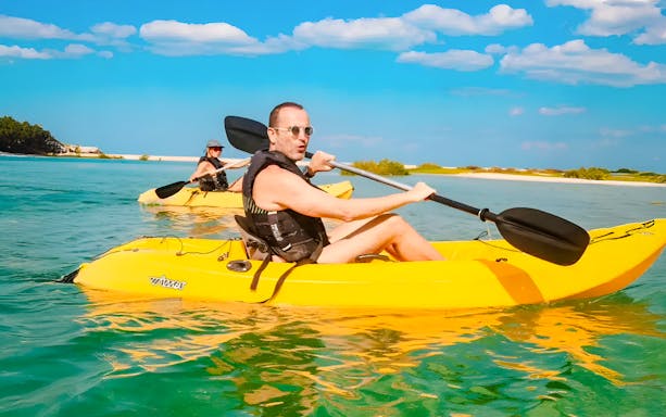 Man kayaking in clear waters at Atlantis, The Palm, Dubai.