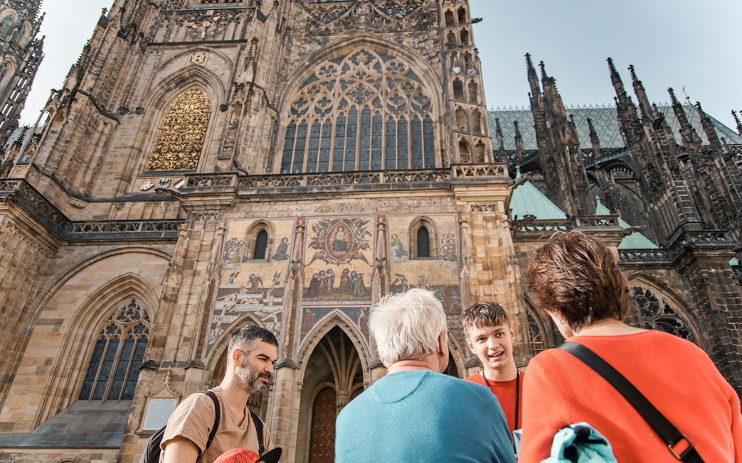 Tour group in front of St. Vitus Cathedral, Prague Castle, during guided tour.