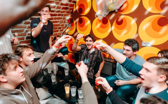 Group enjoying a lively pub crawl in Krakow.