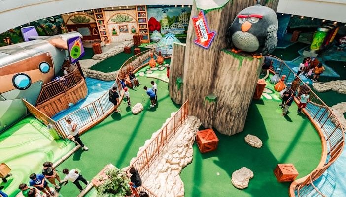 Mini golf course at Angry Birds American Dream with themed obstacles and players.