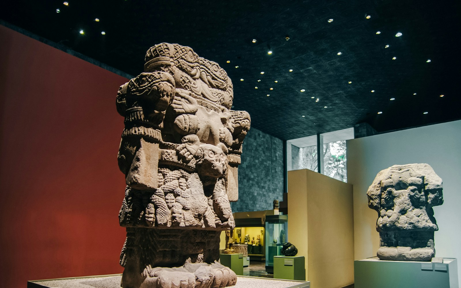 Visitors exploring exhibits at the Anthropology Museum in Mexico City.