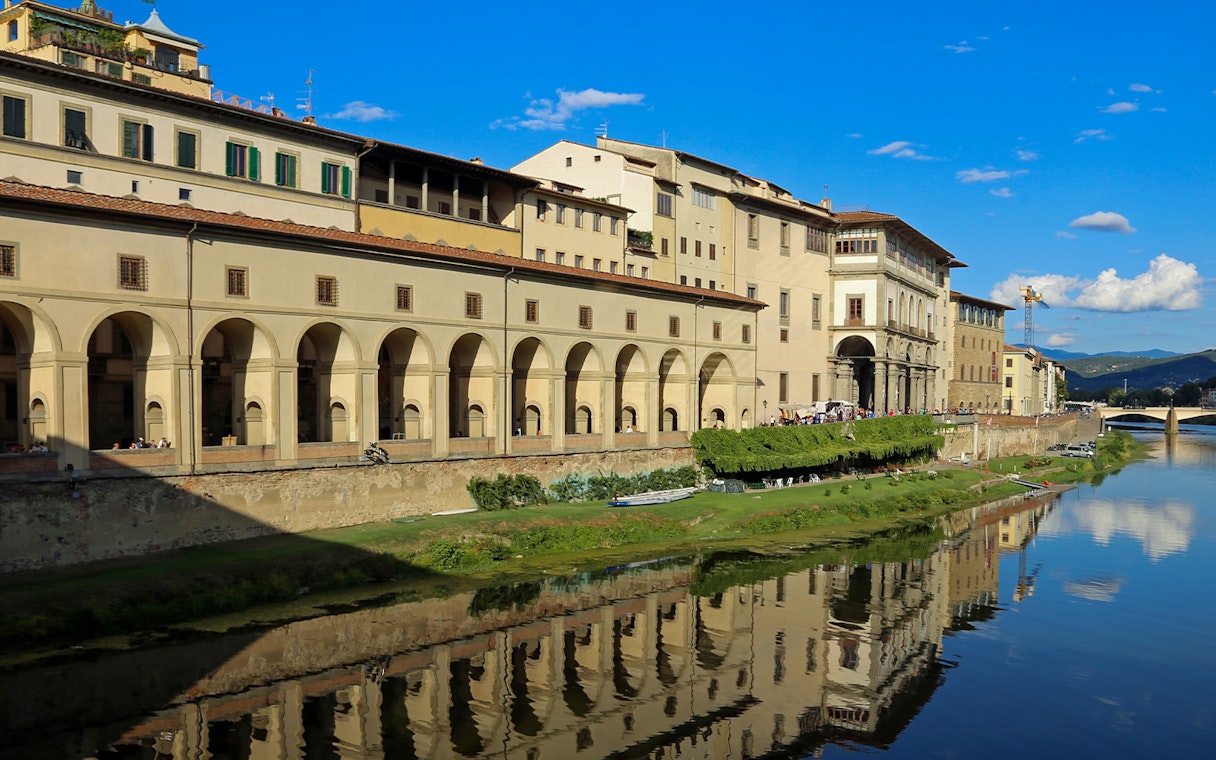 Uffizi Gallery exterior along the Arno River, Florence, Italy, part of guided tour.