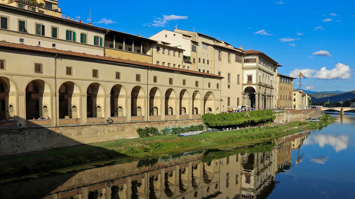 Visitors exploring art exhibits in the Uffizi Gallery during a small group guided tour, Florence, Italy.