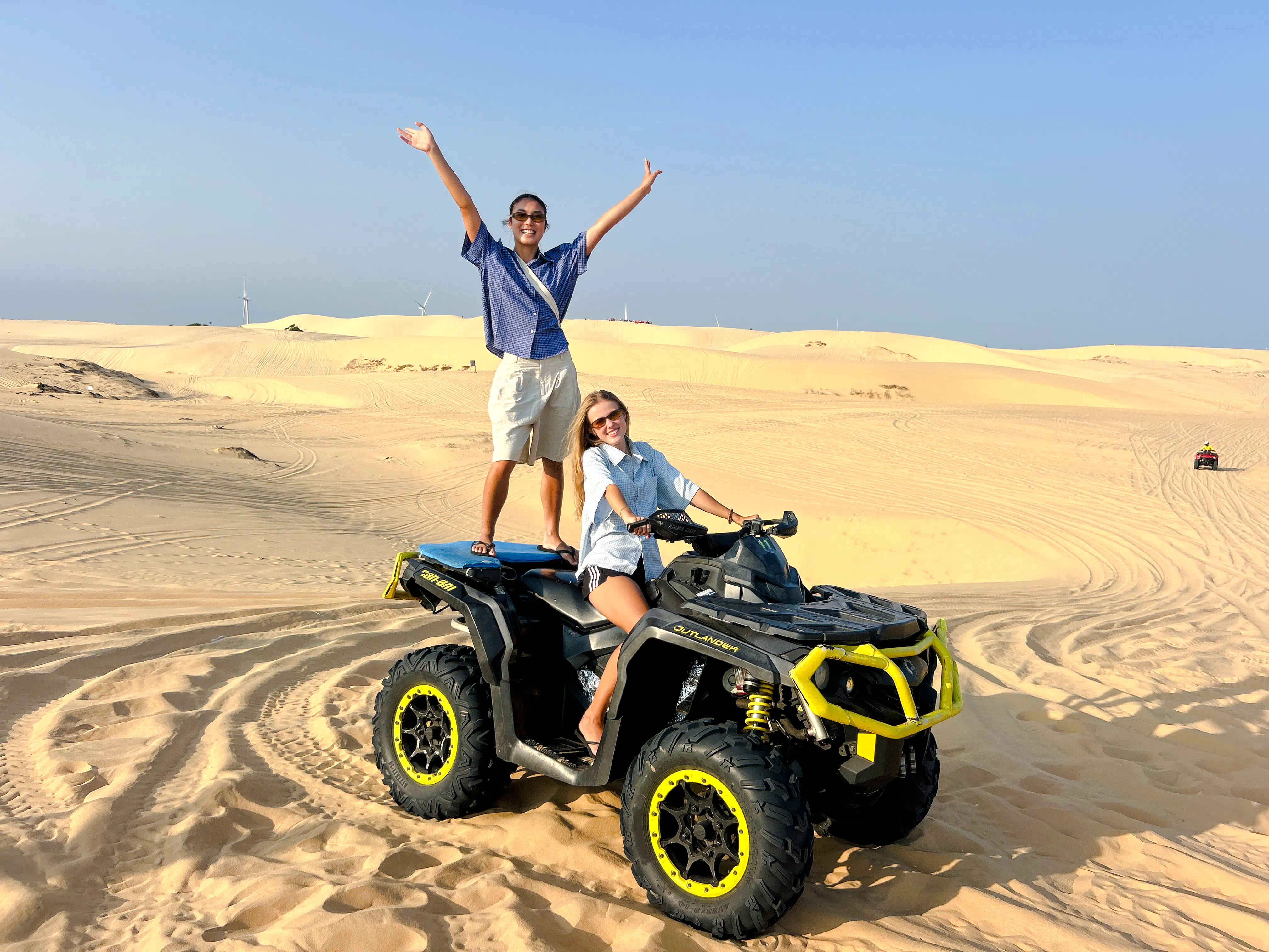 ATV ride on sand dunes during Mui Ne Jeep Tour, Ho Chi Minh City.