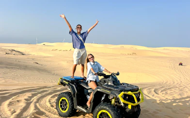 ATV ride on sand dunes during Mui Ne Jeep Tour, Ho Chi Minh City.