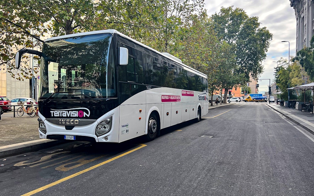 Terravision bus for Fiumicino express airport transfers parked on a city street.
