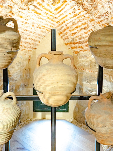 Ancient wine jugs displayed inside the Galata Tower, Istanbul.