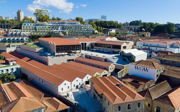 Aerial view of museums in WOW Porto Cultural District with red-tiled roofs and modern architecture.