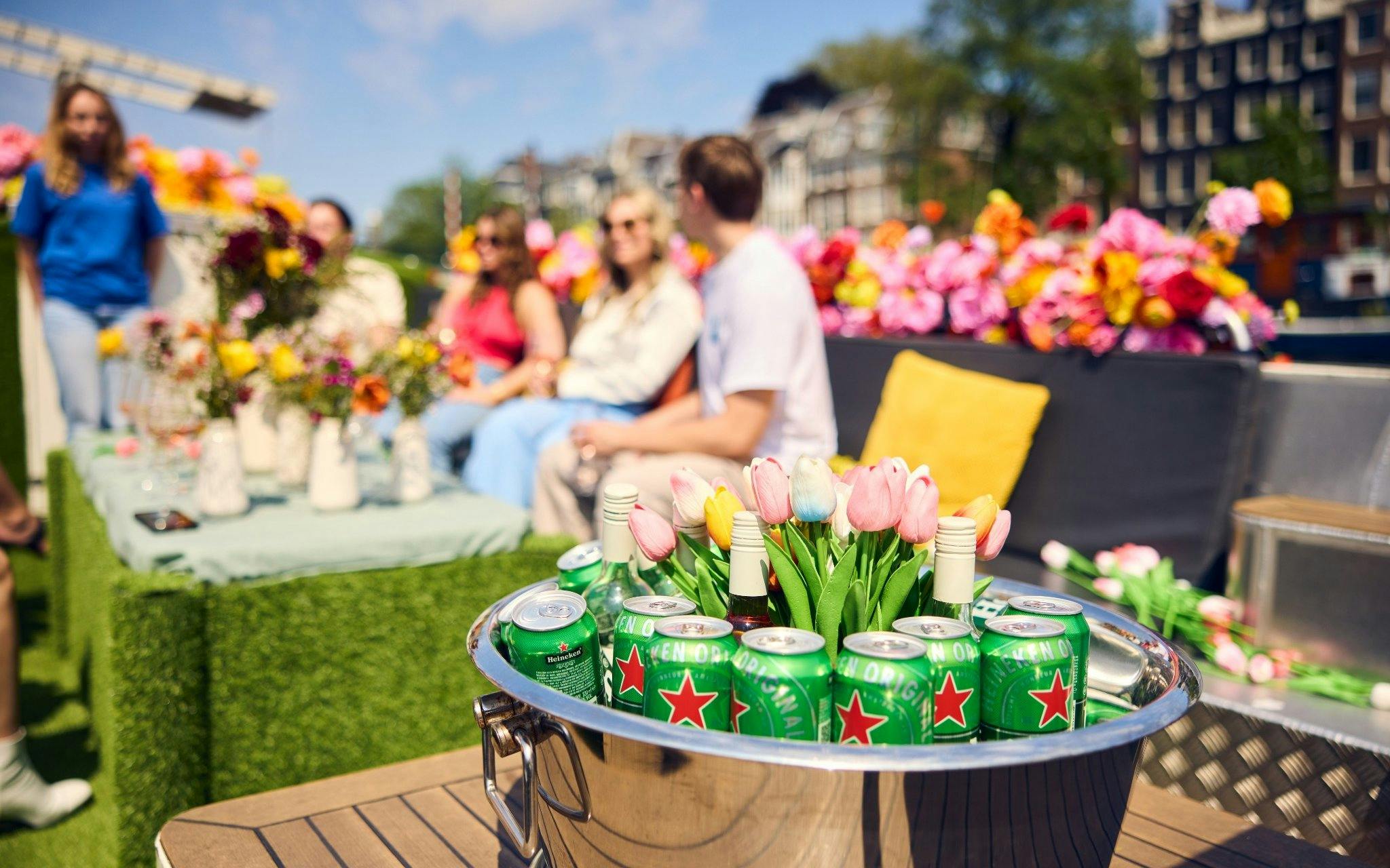 Luxury flower boat with drinks and tulips, people enjoying City Highlights Cruise.