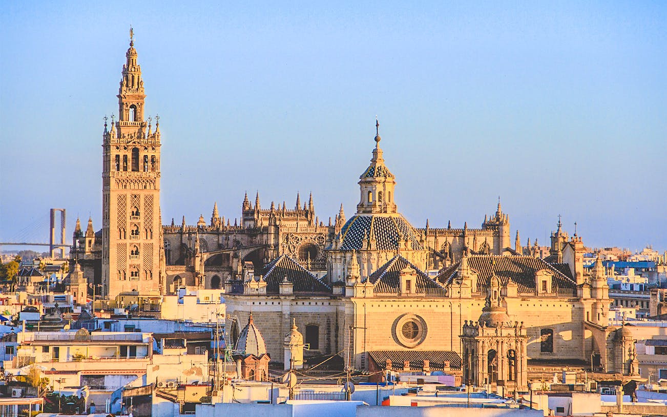 Seville Cathedral exterior with Giralda Tower in Seville, Spain.