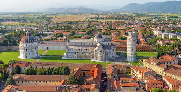 Aerial view of the Leaning Tower of Pisa in Italy during the evening.