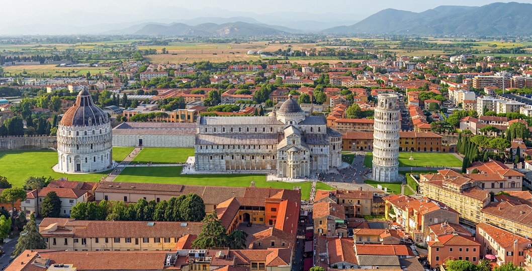 Aerial view of the Leaning Tower of Pisa in Italy during the evening.