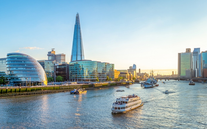 Sightseeing cruise on the Thames River near the Shard in London.
