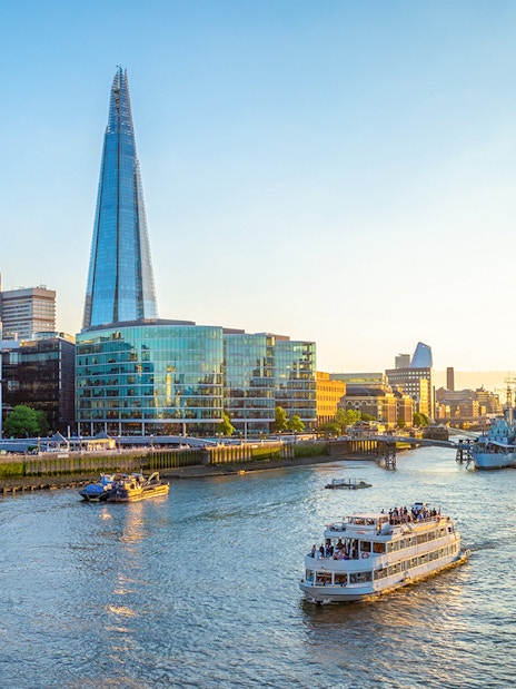 Sightseeing cruise on the Thames River near the Shard in London.