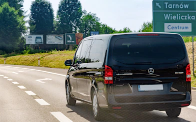 Van traveling on road towards Wieliczka Salt Mine, Poland.