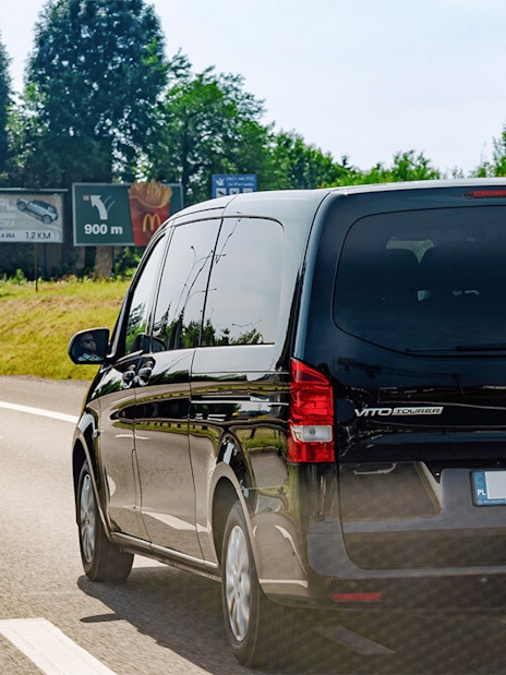 Van traveling on road towards Wieliczka Salt Mine, Poland.