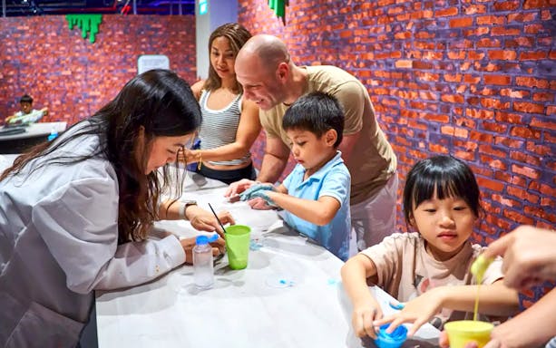 Participants engaging in a hands-on activity at Chaos Lab, Singapore.